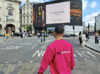 Why Media employee at Picadilly Circus.